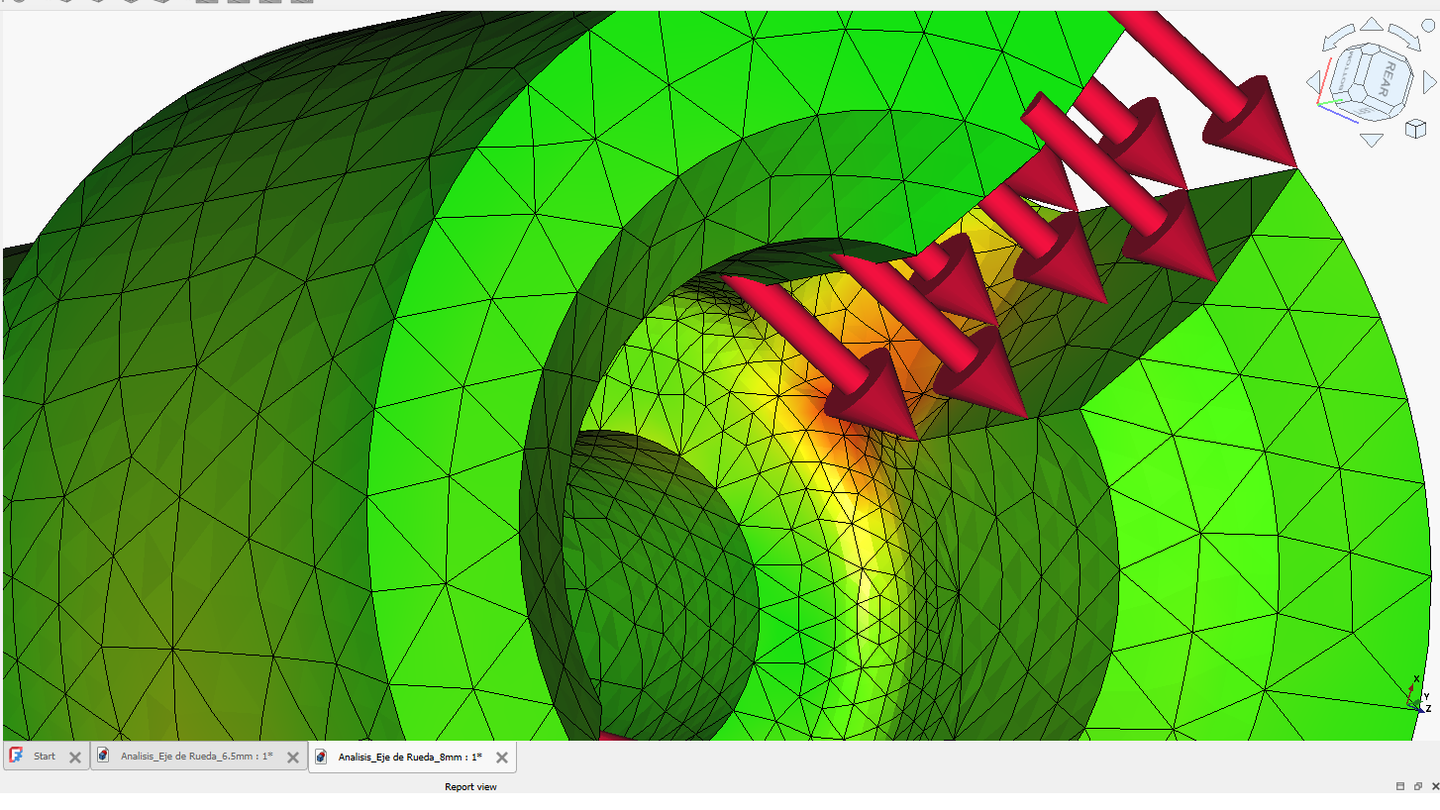 Finite element mesh of a wheel-axle component showing applied loads and a color-coded stress distribution